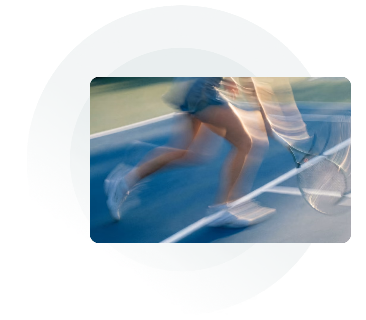 Blurred legs of a tennis player running across a blue court