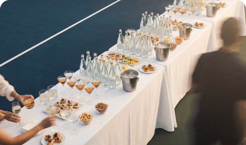Table with drinks and snacks next to the court