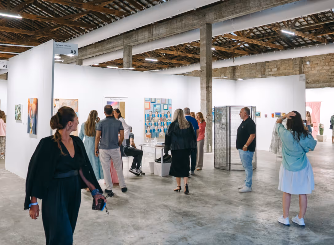 Visitors walking between the gallery booths at VIMA 2026